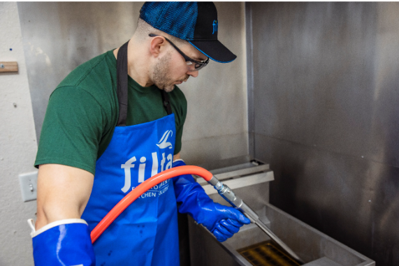 Filta technician carrying out on-site FiltaFry fryer oil filtration